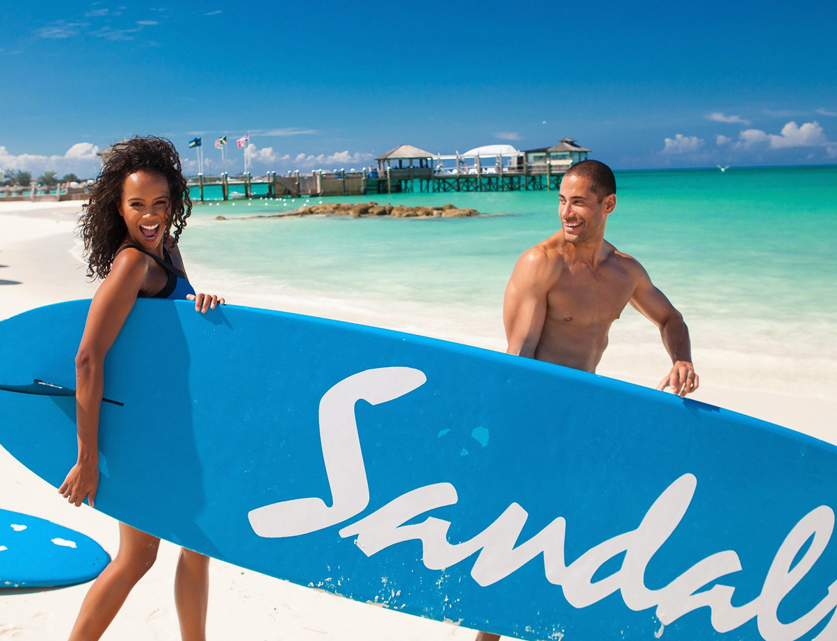 Man and women with surfboard