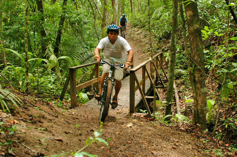 Biking on trails in the Cayo District