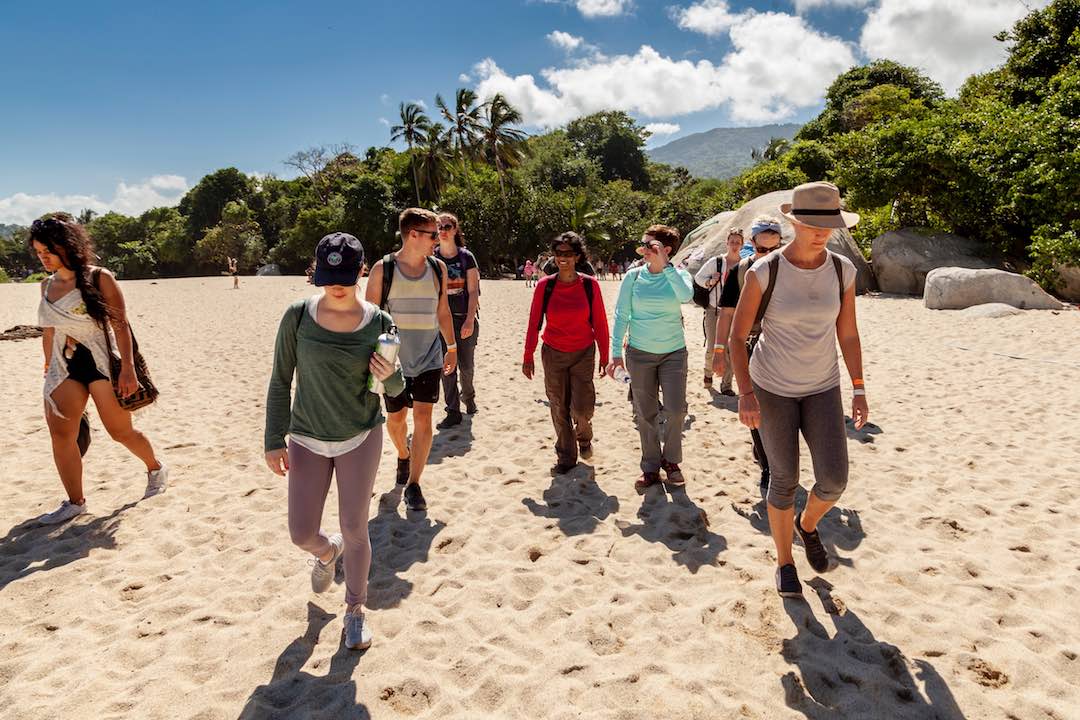 Group travellers on a beach