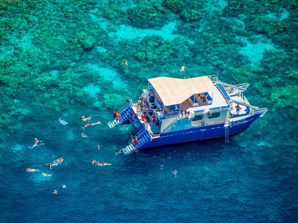 Swimming off a boat in Maui