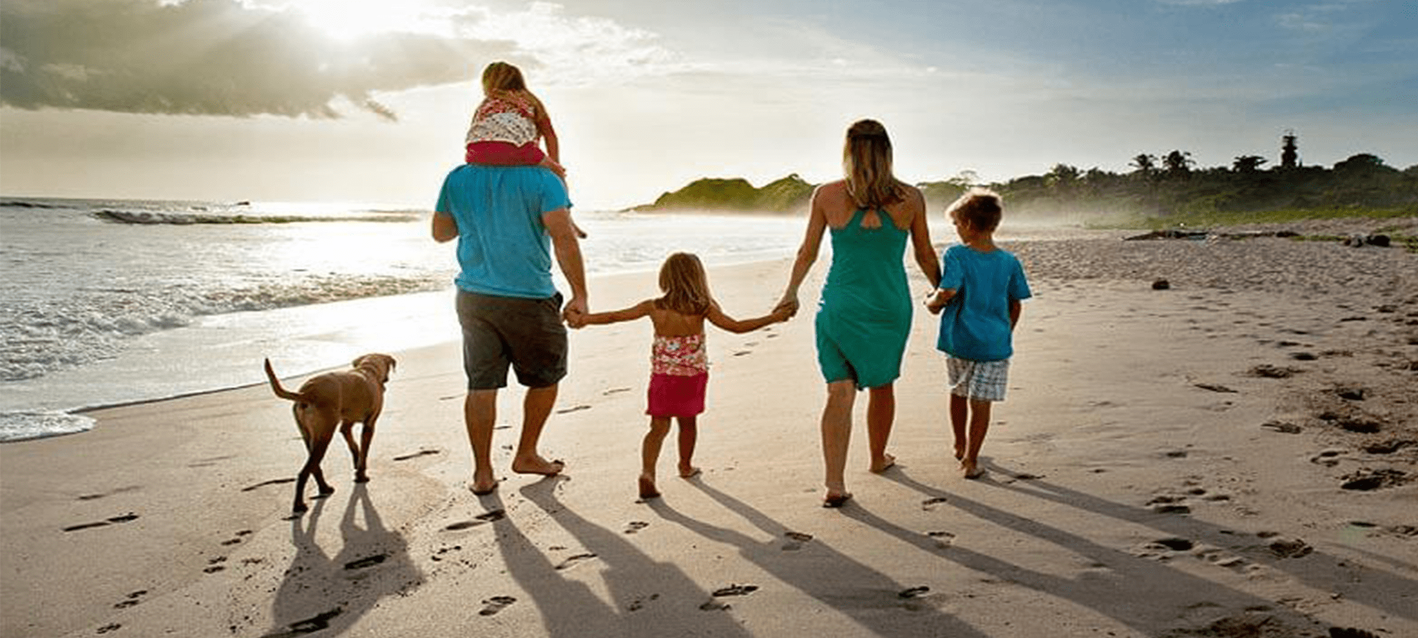Family walking on the beach