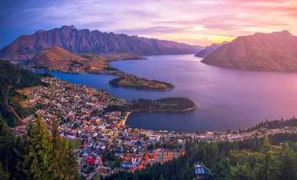Queenstown at twilight with Lake Wakatipu and The Remarkable Mountains in New Zealand.