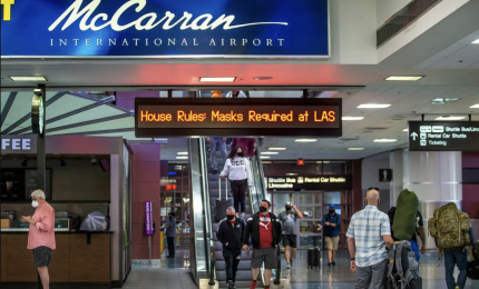 riding the escalator at McCarran Airport