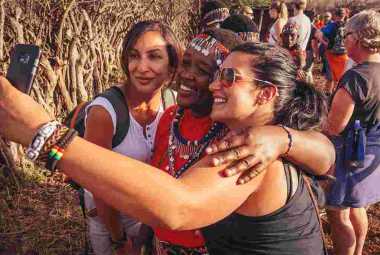 Tourists posing for selfie with native